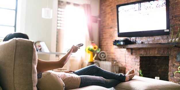 A person watching TV. Photo