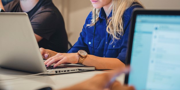 Persons in front of computers. Photo