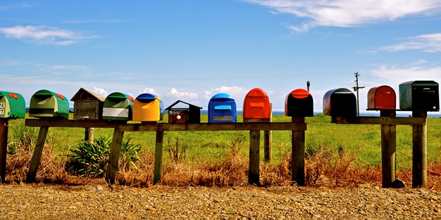 Letterboxes in different shapes and form in the countryside, photo.